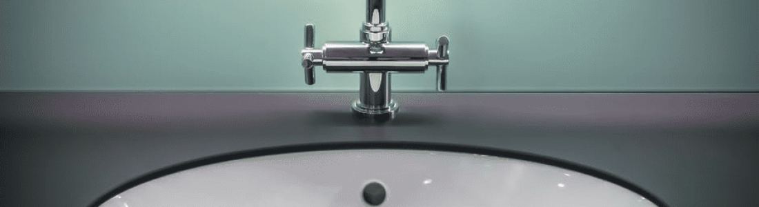 bathroom countertop surface and round sink